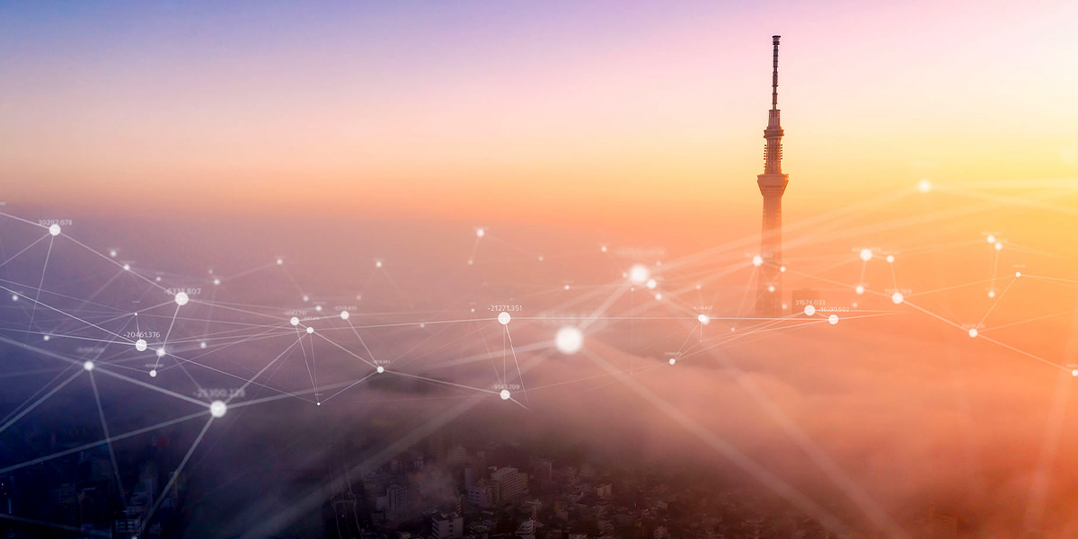 A stock image of the top of a tower rising out of fog. The fog has various data points connected by lines overlayed on top