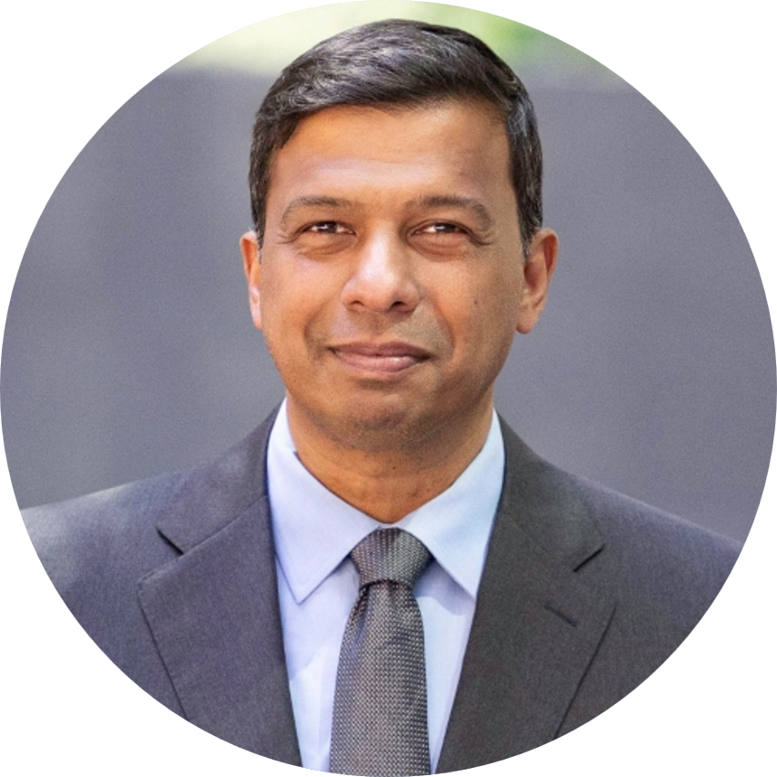 Smiling man in a suit.